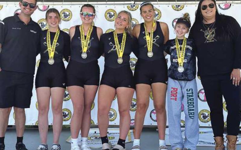 Left to right: Coach Ethan Peters, Emma Brancheau, Ava Rantanen, Tatum Takats, Katherine Cromly, Coxswain Tori Grayson and Coach Lydia Marentette.