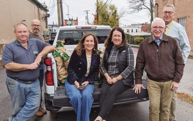 The Perrysburg Rotary Club recently provided free Thanksgiving meals to those in need through donations to the Perrysburg Christians United Food Pantry. Above, members of the club are pictured collecting donations from Kazmaier’s in Perrysburg. Food was distrubuted at the food pantry on Saturday morning.