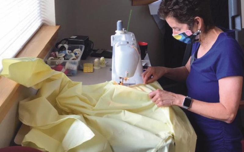 Mrs. Seibenick sews protective gowns for her staff during the pandemic’s initial stages when PPE was hard to find.