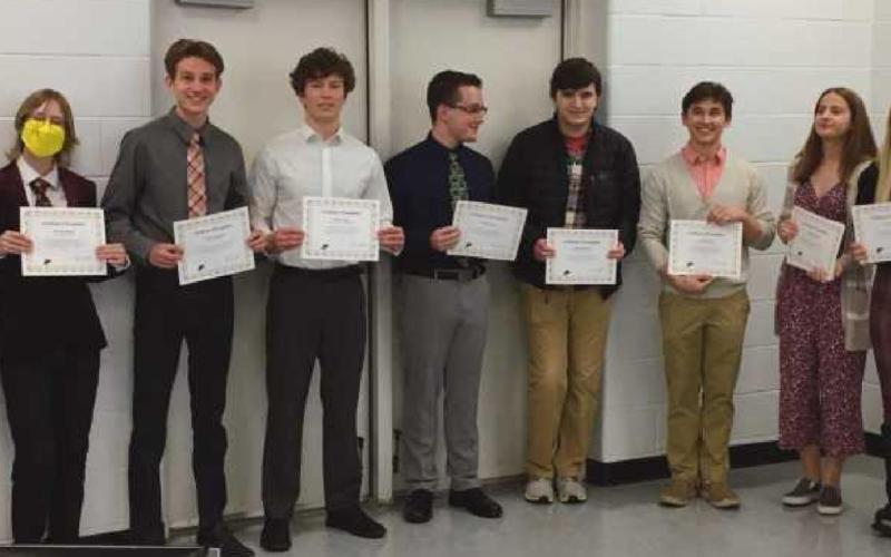 At the school board meeting, are from left: PHS Principal Aaron Cookson, and PHS seniors Karen Li, Emmett Bohney, Nathan Thompson, Nathan Stepp, Michael Brown, Grant Knowlton, Owen Laib, Lauren Sandberg, Jenna Rettig and Lindsey Lazor, with school board member Lori Reffert.