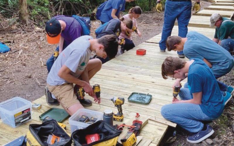 Area youth lay planks for W.W. Knight boardwalk