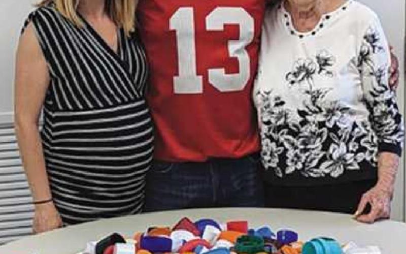 From left: Jessi Chapman, Perrysburg Area Senior Center site manager; Bruno Rivera, who collected the most lids, and Connie Stallter, organizer of the project.