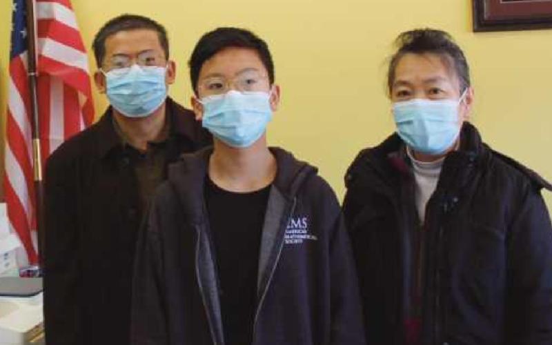 Patrick Chen, middle, PJHS, second place, and his parents, Dr. John Chen and Mrs. Binglin Chen.