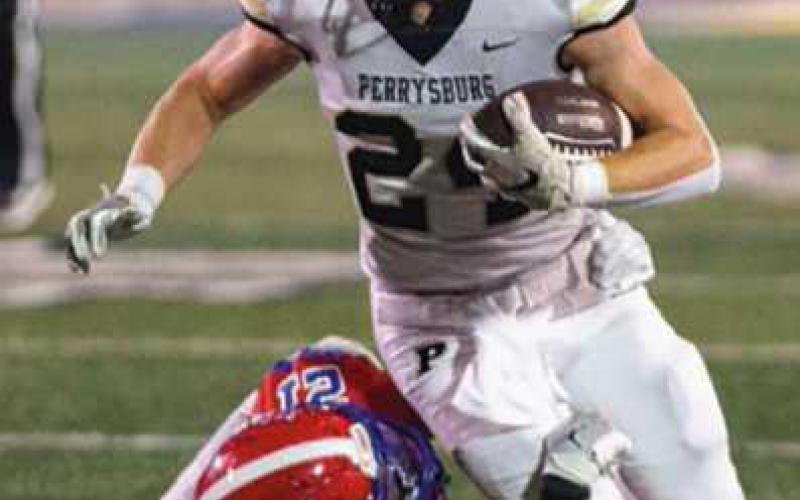 Nico Walkosky carries the ball for the Yellow Jackets.