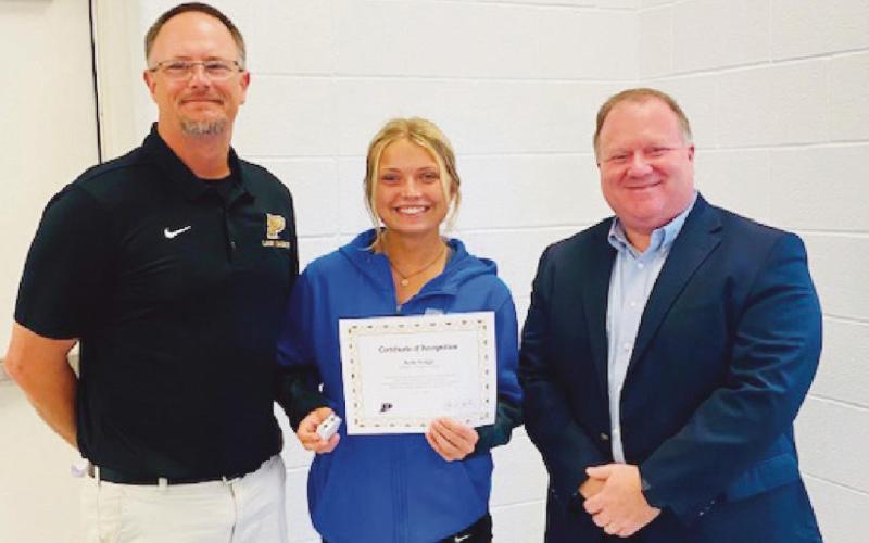 From left, Ryan DeMars, head softball coach; Kylie Griggs, First Team All-State; and Eric Benington, school board member.