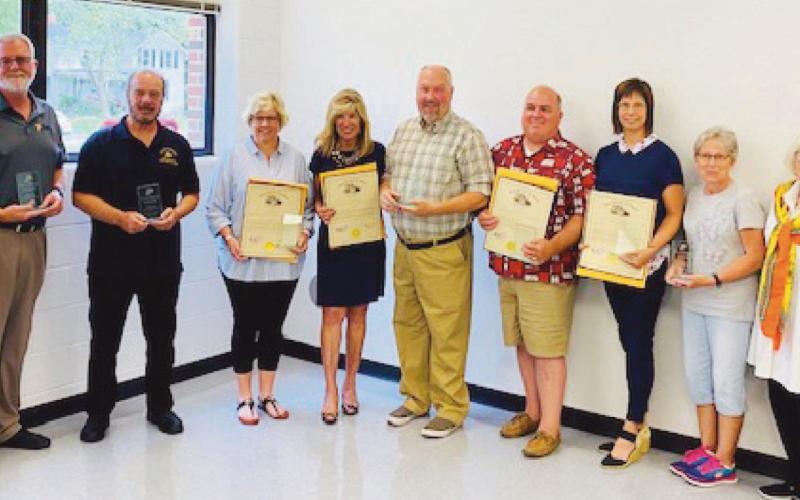 Retirees with school board president Ray Pohlman, far left, Mrs. Downs, second from right, and State Representative Haraz Ghanbari, far right: Dr. Michael Short, Dennis Lehmann, Deb Drew, Lynne Barefoot, Rob Gentry, Don Griffith, Jen Verbosky and Ellen Bradley.