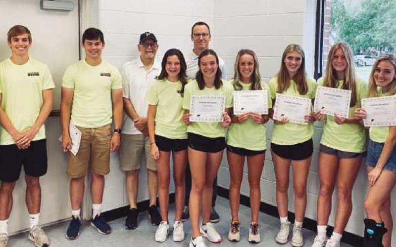Track team from left, first row: Ben Keller, Kieffer Doore, Dylan Ball, Sydney Daudelin, Brooke Daudelin, Avary Zeisloft, Ashlyn Haeft, Adelle Francis, Maddy Wagner and Coach Andrea Monheim. Back row: Coach Jim Hentges and Coach Matt Mullan.