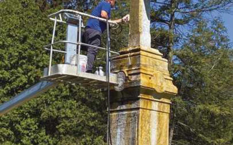Volunteers help shine up St. Rose cemetery monument