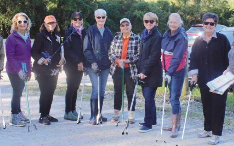 Lauren Rush, stormwater coordinator for the City of Perrysburg, far right, with Country Garden Club volunteers, from left, Kim Frazier, CGC conservation committee chair; Bonnie Ash; Judy Reitzel; Karen Hinkson, Holiday Trunk Show co chair; Pat Smith; Ursula Kluge; Jan Connors; Michele Alexander and Annette Sipp.