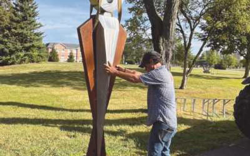 Mike Erard positions the piece, Odyssey.