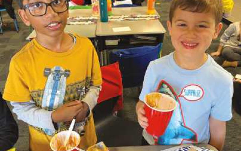 Elementary students prepare pumpkin pie in a cup