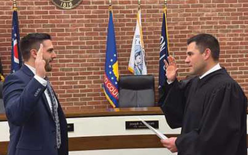 Cory Kuhlman was sworn in by his brother, Judge Joel Kuhlman.