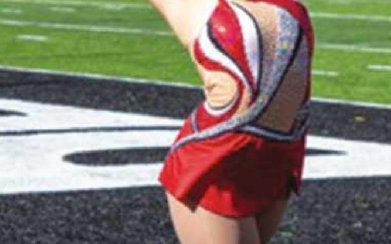 Lexi Peats twirls at Cotton Bowl