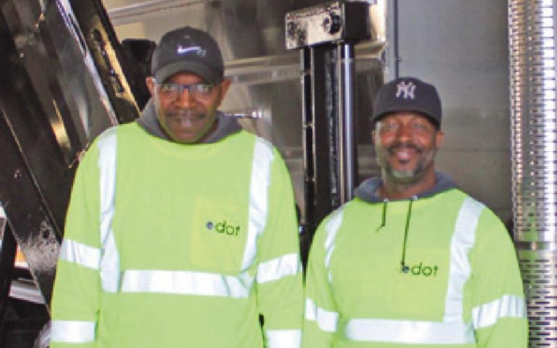 Derrel Rankins, left, and Anthony Hicks, are among the crew working to ensure equipment is road ready this winter.