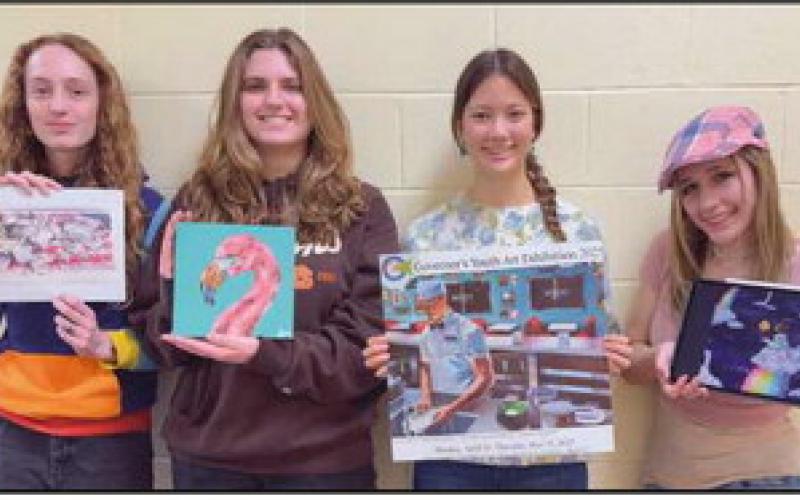 Madison Fisher, Sienna Momberg, Iris Weinstein and Gia Soto with their artwork.