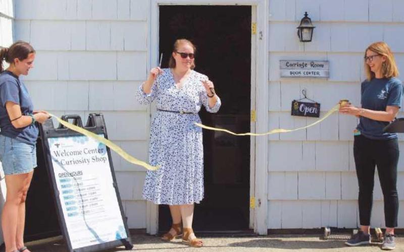Executive director Heather Gallant opens the new Welcome Center and Curiosity Shop. At right, pottery and other items are featured in the new center.