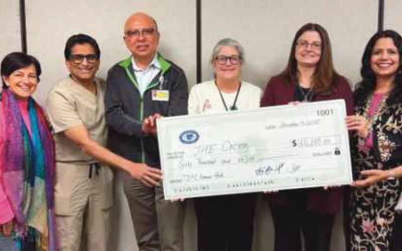 From left: Dr. Srini Hejeebu, Dr. Maneesha Pandey. Dr. Raj Kattar, Current TOPI President Dr. Sanjoy Banerjee, Cocoon Director of Development and Communications Robin Guidera, Cocoon Executive Director Kathy Mull, 2026 TOPI President Dr. Shalini Singh Coates and Dr. Rashmi Goyal Hejeebu.