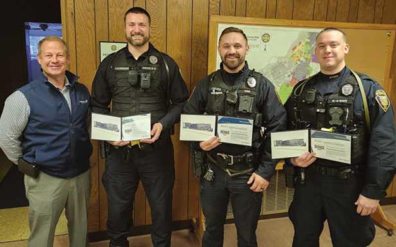 From left, Daniel Deiter of Modern Woodmen of America, presented Hometown Hero awards to Ptl. Kurt Schroeder, Ptl. Clayton Ringle and Ptl. Nicholas Owens.