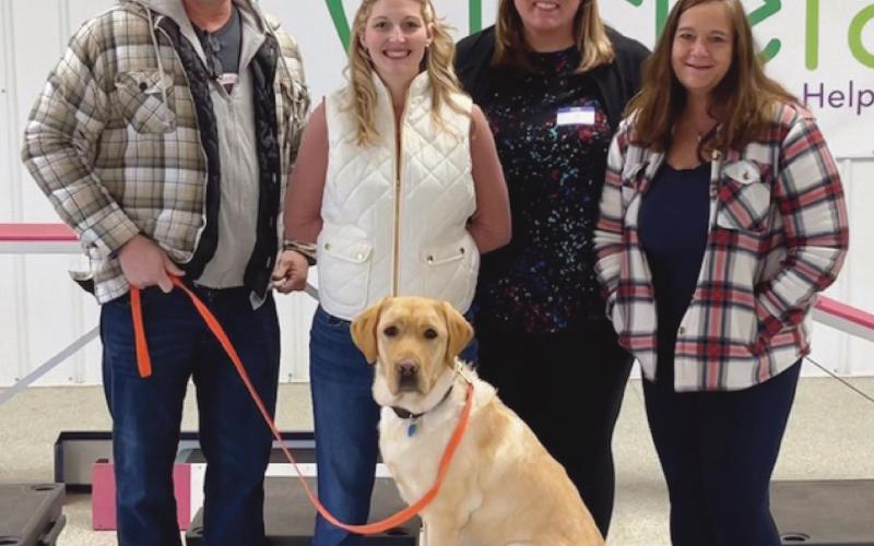 Taft, on his last day of training, with, from left, his host away from school, John Henline, teacher and assistant athletic director; and his handlers at school, Janice Ray, dean of students, Sadie Browne, intervention specialist, and Alana Sigg, counselor.