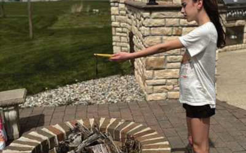Lilian Barkholz, sixth grade student at HPI, uses a digital thermometer to collect air temperature data during the April 8 solar eclipse. The data was submitted to the NASA GLOBE program as part of a citizen science project.