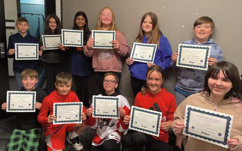 Sixth grade students at Hull Prairie Intermediate School recently received honors for helping NASA with total solar eclipse data collection. Front row, from left: Lincoln Sandwisch, Landon Knestrick, Graham Brossia, Julia Atkinson, Aly Ebert. Back row: Elias Lewis, Ryleigh Avalos, Gauri Pandav, Lily Lemon, Lucy Johnson, Devin Wladkowski. Not pictured: Lilian Barkholz.