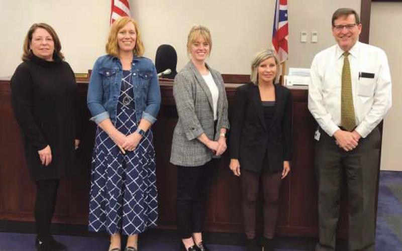 From left: New CASA volunteers Sue Danes, Betsey van de Heijning, Amber Windom and Kathy Mikolajczak were sworn in by Judge Dave Woessner.