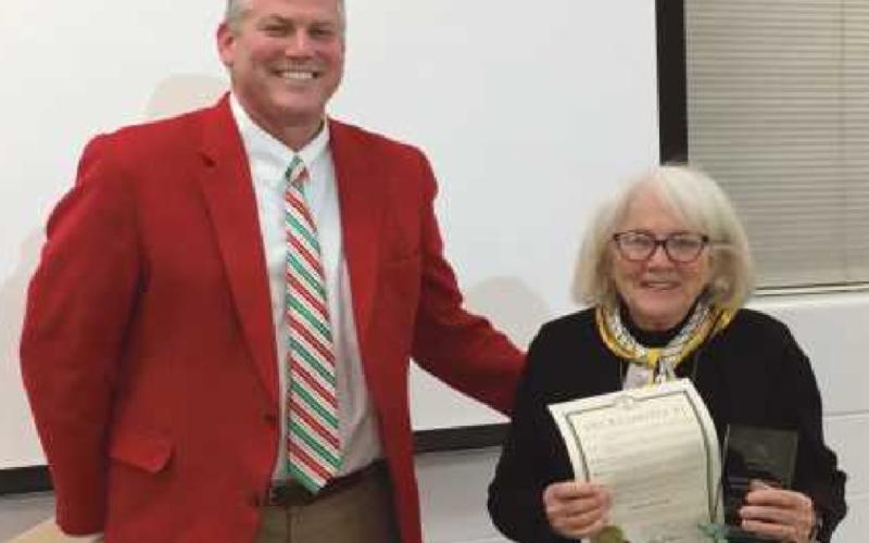 Superintendent Hosler presents board member Gretchen Downs with the City of Perrysburg’s proclamation declaring December 20, 2021, “Gretchen Downs Day.”