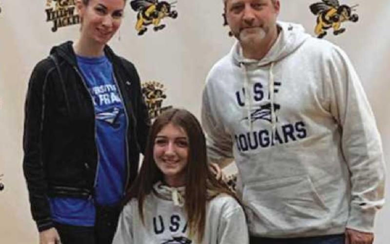 Abby Wozny, soccer, University of St. Francis at Fort Wayne, with parents Amy and Tim Wozny.
