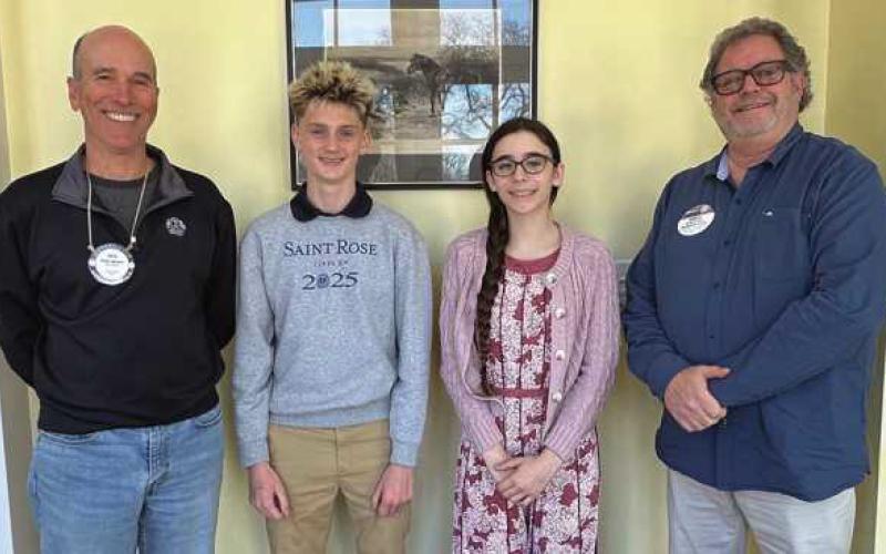 Winners of 2025 Four-Way test are, from left: Perrysburg Rotary Pete Allesee, Grayson Destatte, Delilah Torio and Perrysburg Rotary President-Elect Greg Rufty. The students received first place in the essay contest at St. Rose and Perrysburg Junior High School, respectively.
