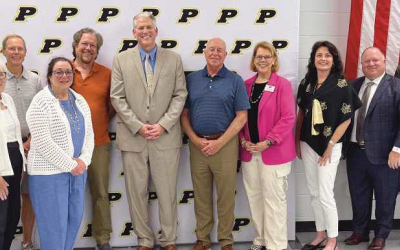 Perrysburg Board of Education members past and present who served during the tenure of Superintendent Thomas Hosler (2007-2025). Front row, from left: Gretchen Downs and Valerie Hovland. Back Row: Susan Rowland Miller, Ray Pohlman, Walt Edinger, Tom Hosler, Barry VanHoozen, Sue Larimer, Laura Meinke, Eric Benington and Chris Anderson.