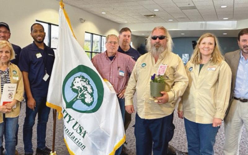 Accepting the award on the city’s behalf are members of Perrysburg’s Street Tree Commission. Pictured above from left are Greg Kuhr, Christine Ardley, Mark Easterling, Jim Hagen, Dan Ledyard, Scott Kirby, Kali Sawaya and Dan Balser, ODNR Division of Forestry chief.