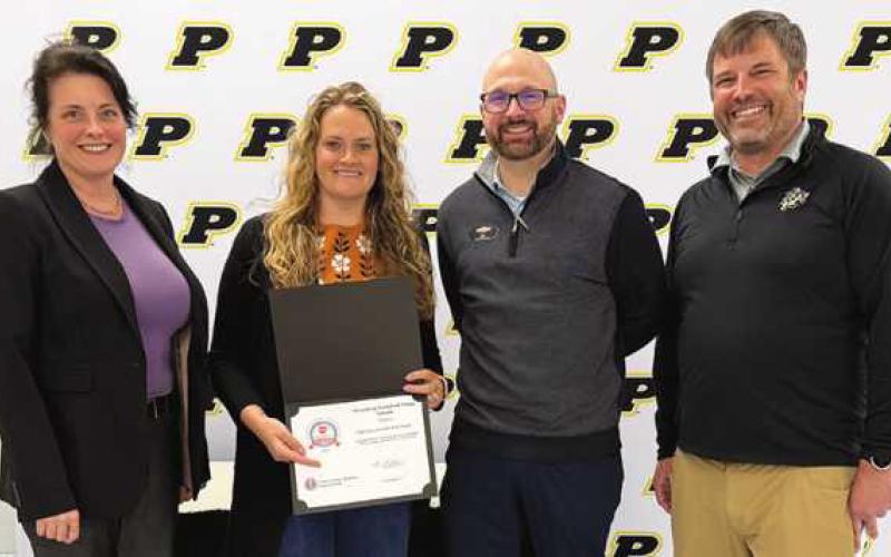 From left: Laura Meinke, board of education member; Emily Yark; DJ Suppan, Yark Chevrolet general manager, and Jeff Abke Class of 1996, CFRE, CEFL, director of development and alumni relations for Perrysburg Schools.