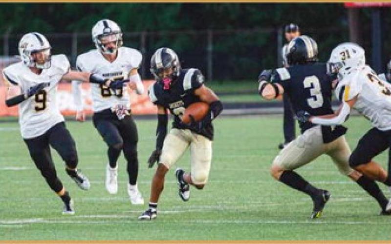 Dominick Woods finds an opening and skirts past Northview defenders.