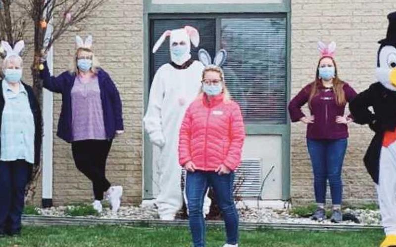 Employees from The Commons with Peter Cottontail and Perry the Penguin.