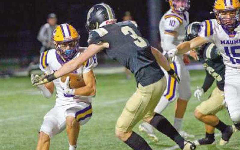 Defensive back Matt McEwen stops quarterback Carson Graetz.