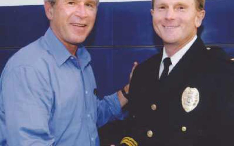 Above left, President Bush spoke to a crowd of approximately 12,000 people while at Fort Meigs in 1984. Above right, then Perrysburg Police Chief Rick Gilts with President Bush.
