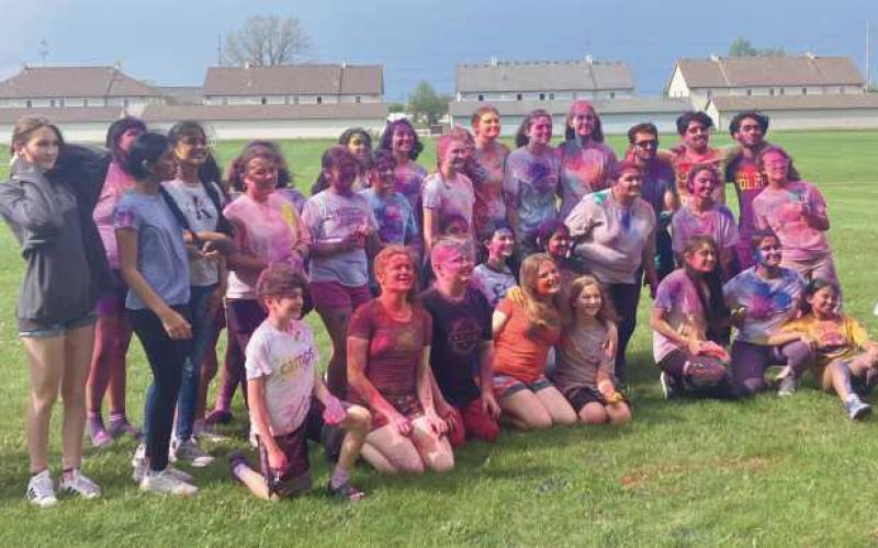 Students and community members participate in the color run (above and below).