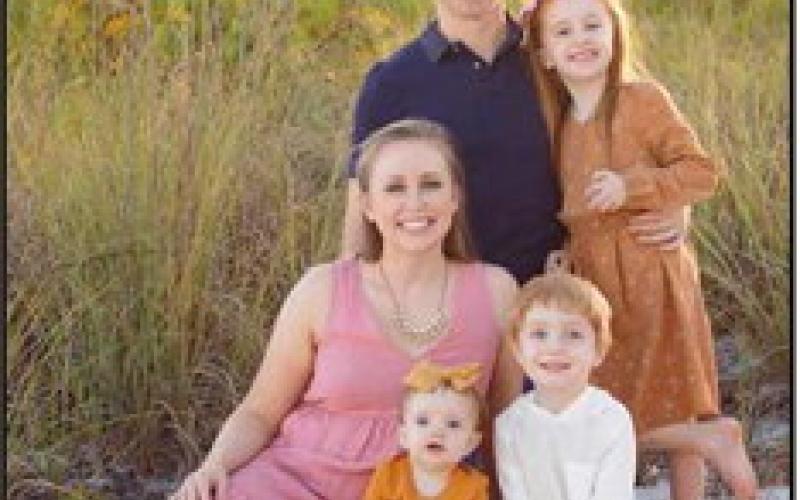 Dr. Moore with his wife, Dr. Manis, and their three children.