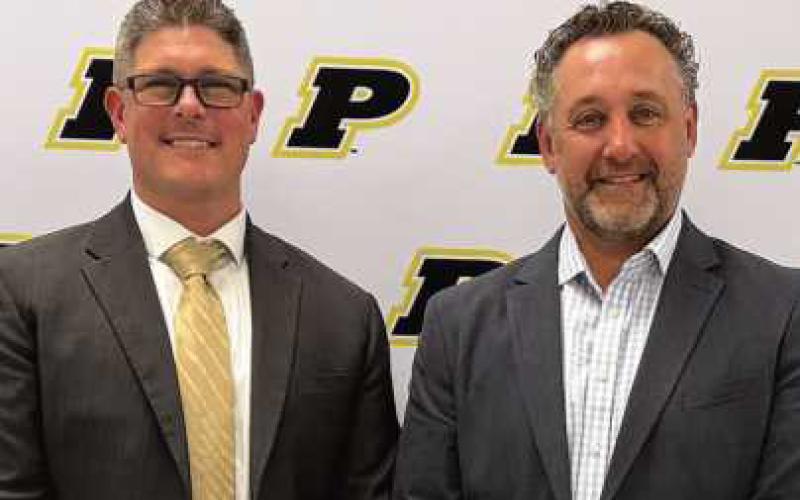 Pictured from left: Dr. Brad Contat and Mike Acomb.