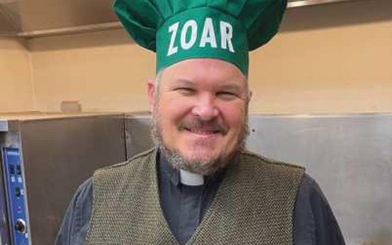 Zoar Pastor Paul Reichert helps at a recent Kitchen of Hope dinner.
