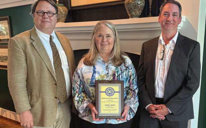 Pictured from left: David Munger, Way Library Board of Trustees; Way Library Director Janel Haas, and Way Library Assistant Director Travis McAfee.