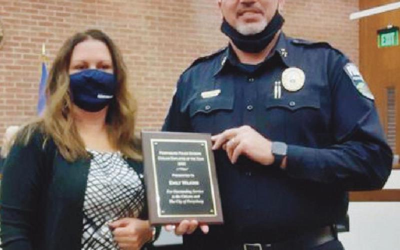 Chief Jones presents Emily Wilkins with her Civilian of the Year award. Ms. Wilkins is a records clerk with the police division.