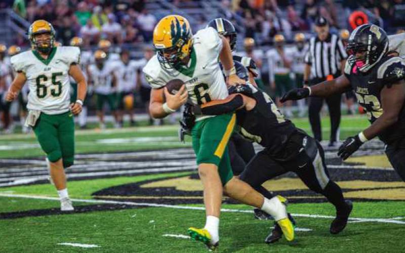 Junior Jonathan Butterfield tackles Clay’s quarterback.