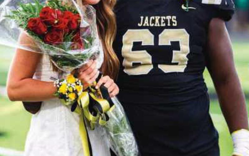 Homecoming queen Sydney Evert with king Eric Bush.