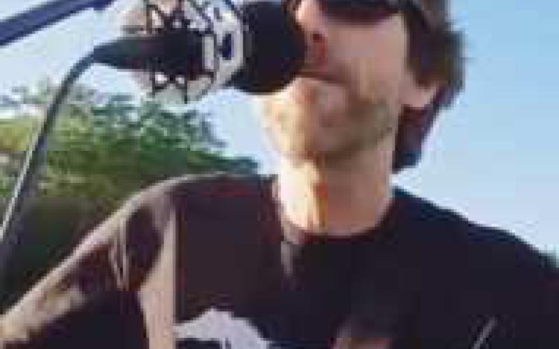 Local musician Slim performs at the Slow Roll.