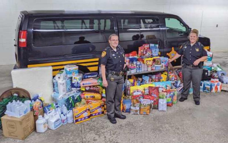 Area residents donate supplies for sheriff’s dept. pet food drive
