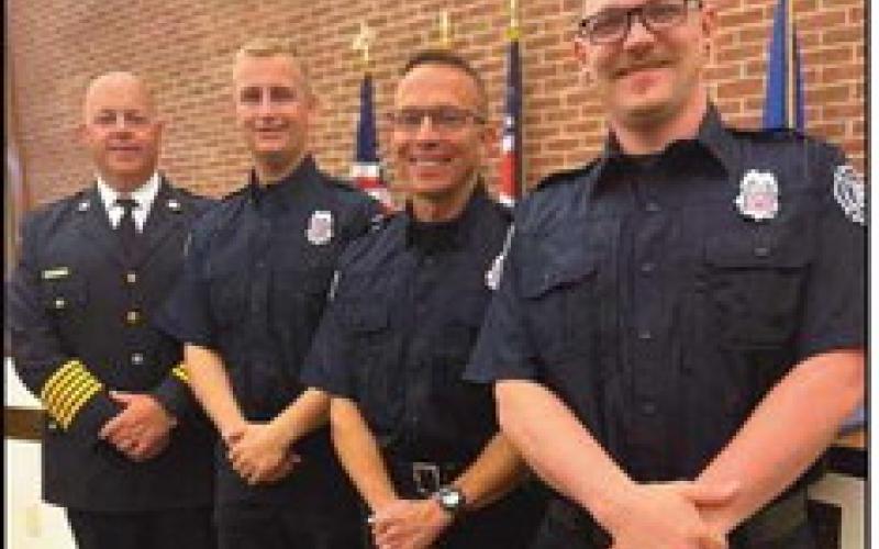From left, Chief McCullough with Layne McNeal, Joel De-Long and Greg Robertson.