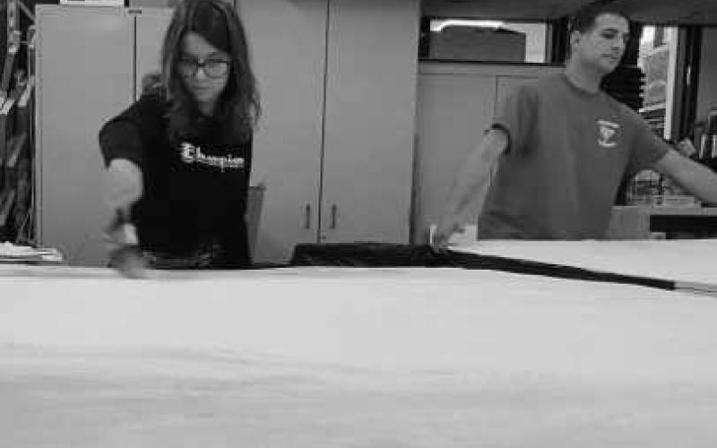 At left: Max Baca prepares to begin rehearsal as Will Shakespeare in Act 1, Scene 1. Above: Set construction crew member Helena Souza and Tech Director Chris Skiver work on set walls in the scene shop.