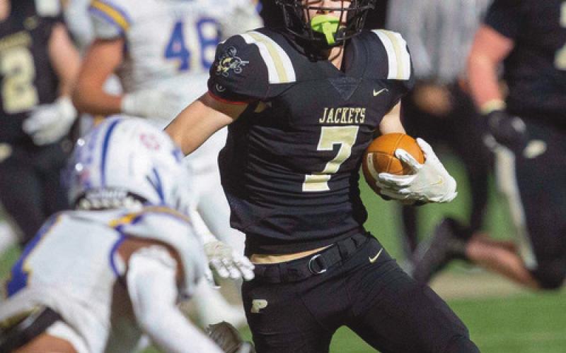 Wide receiver Andrew Hunt attempts to thwart a Findlay defensive back.