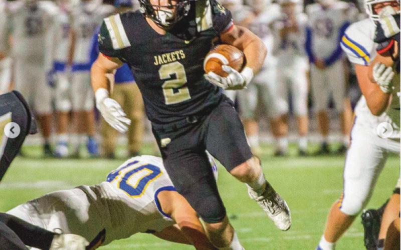 Running back Connor Walendzak breaks through the Findlay line.